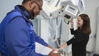 X-ray techs set up their machine for testing.
